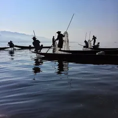 Fishermen on work at Inle Lake, Myanmar. Local fishermen 