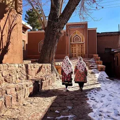 Tourists wearing traditional clothes of #Abyaneh walk in 