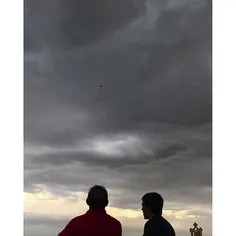 A man is flying a #kite on the premises of the Milad towe