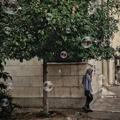 A woman talks on the phone in a sidewalk. #BandarAbbas. #