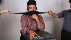 محمد علی نژاد ۵۵ ساله ساکن شهر خورموج استان بوشهر با طول 