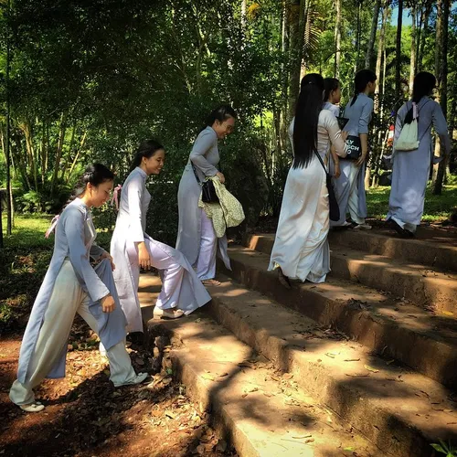 Girls wearing Ao Dai, traditional long dress, to attend V
