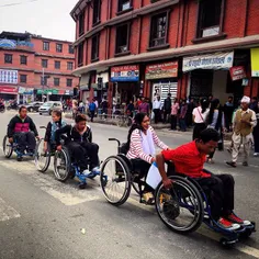 Nepalese disable people on their wheel chair cross the ro