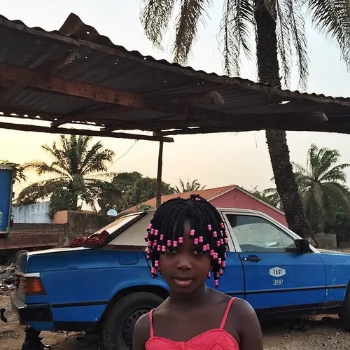 Nine-year-old Koumbasine poses for a portrait in Bissau, 