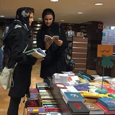 Two women seeing through #books at the #BookCity | 16 Feb