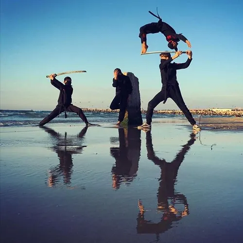 Members of a Gazan martial arts group perform on the beac