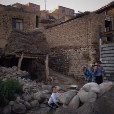 Young boy helping his parents to build a house in #Iranak