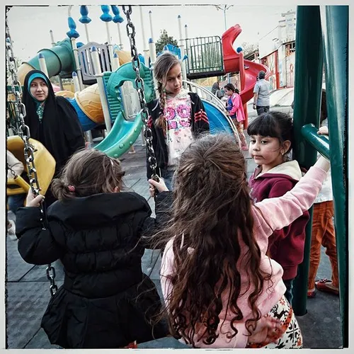 Girls playing in Shaghayegh Park playground, in Saadataba