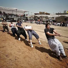 Participants in an open tug-of-war competition held on th