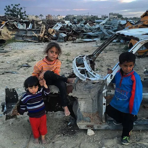 iPhone photo . Palestinian children play outside their ho