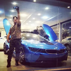 A man takes a selfie with a BMW i8. #Tehran, #Iran. Photo