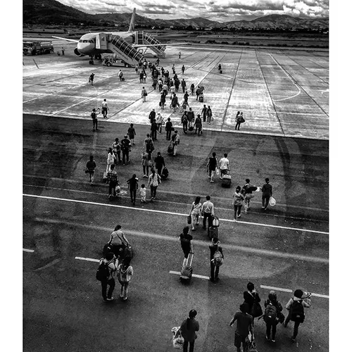 Passengers boarded an airplane by walking along the groun