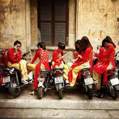 Girls wearing Áo Dài, Vietnamese traditional long dress, 