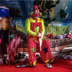 A clown gets dressed before performing at the Rambo Circu