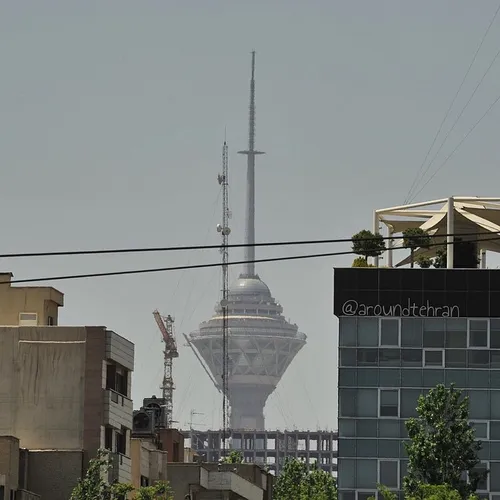 The tip of the Milad tower in the far background is seen 