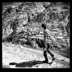 An Indian labourer walks up the mountain in #Leh #India #