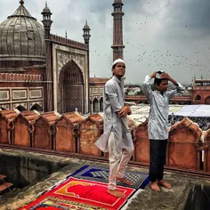 Young Indian Muslim devotees feel the wind before the sta