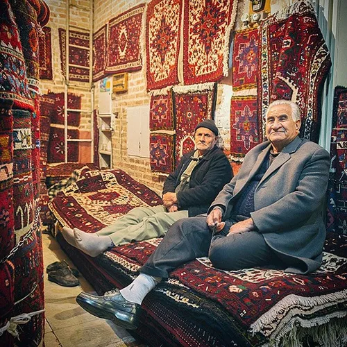 Handmade carpet and rug sellers at their store. Tabriz, E