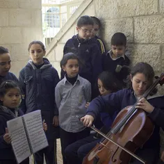 During recess, elementary school students listen to a cla