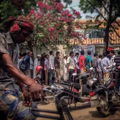 Men queue at an Indian visa center in Dhaka, Bangladesh. 