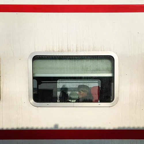 A passenger sits in a train heading to Karbala, at Baghda