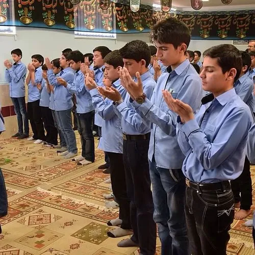 Students saying their prayers at the school prayer hall. 