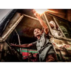 A man rides a bus in Dhaka, Bangladesh. Photo by @allison