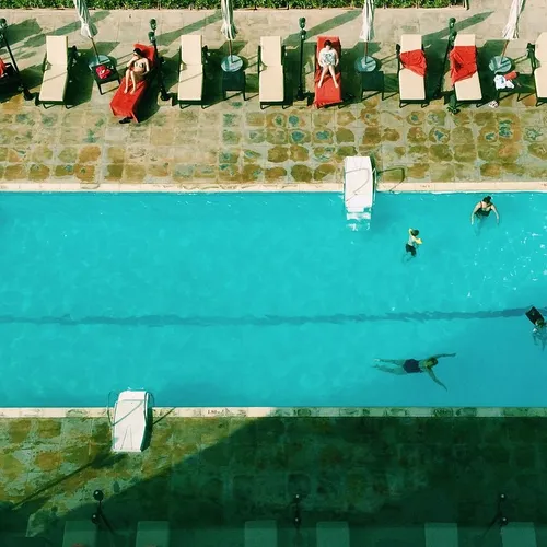 Hotel guests enjoying the pool, Dubai, UAE, 2015. iPhone 
