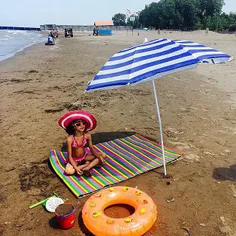 Sara, 6, sunbathing on the beach. #CaspianSea, #Tonekabon