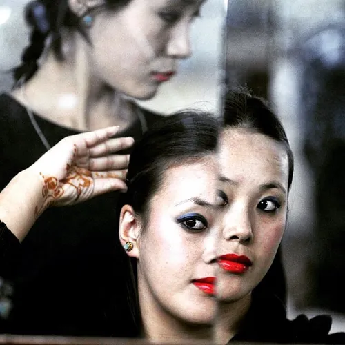 Tibetan folk dancer getting ready for performance travelg