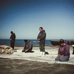 Fishermen saying their prayers on Myankaleh Beach at brea