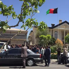 Police and reporters around the residence of President As