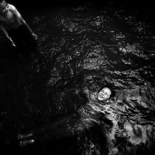 Kids swimming in a pond. Shiraz, Fars, Iran. Photo by Sab