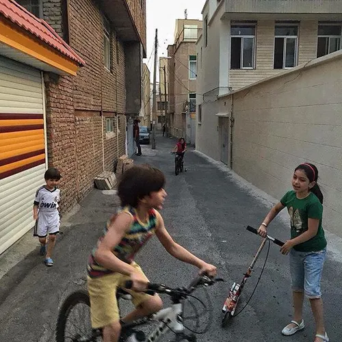 Kids playing outside their houses. According to Islamic r