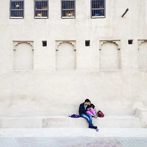 A couple shares an intimate moment in old Dubai. Photo by