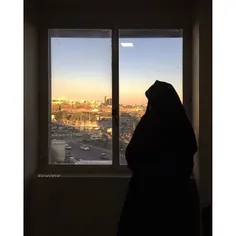 A woman in Chador is looking through the window. | 11 Nov