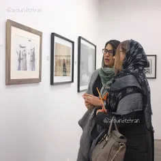 Women looking at a work by late Sadegh #Tirafkan at the S