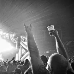 Concert goer, beer aloft. Rolling Stones. Picture made by