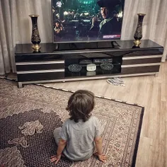 A child watching TV.
