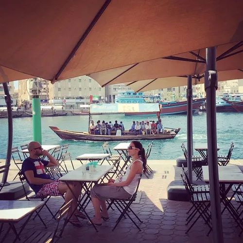 Diners sit at Creekside Cafe in Bur Dubai, UAE. Photo by 